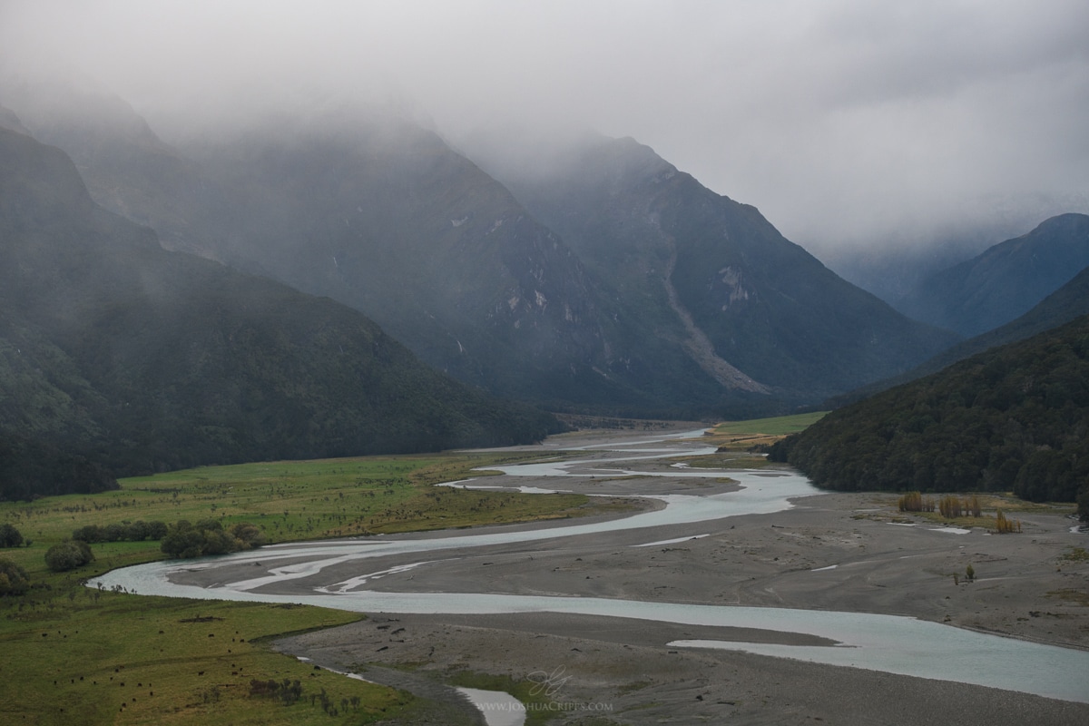 Rain and low cloud shroud the mountains above the Wilkin River
